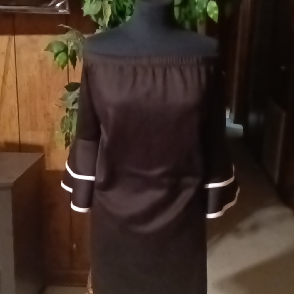 A black and white off the shoulder dress.